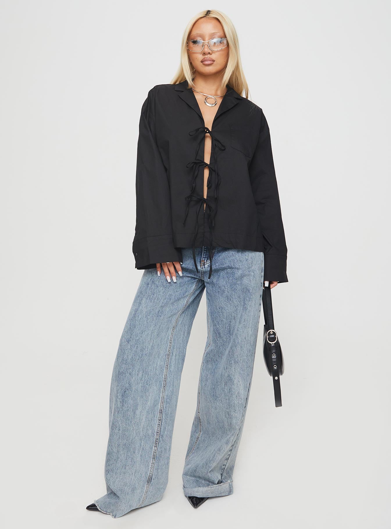 front view of model wearing Princess Polly Spiri Shirt Black Full Sleeves V-Neck 