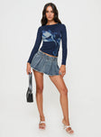 Faded blue denim Low rise mini skort Belt looped waist, zip fastening at side, pleated design, built-in shorts