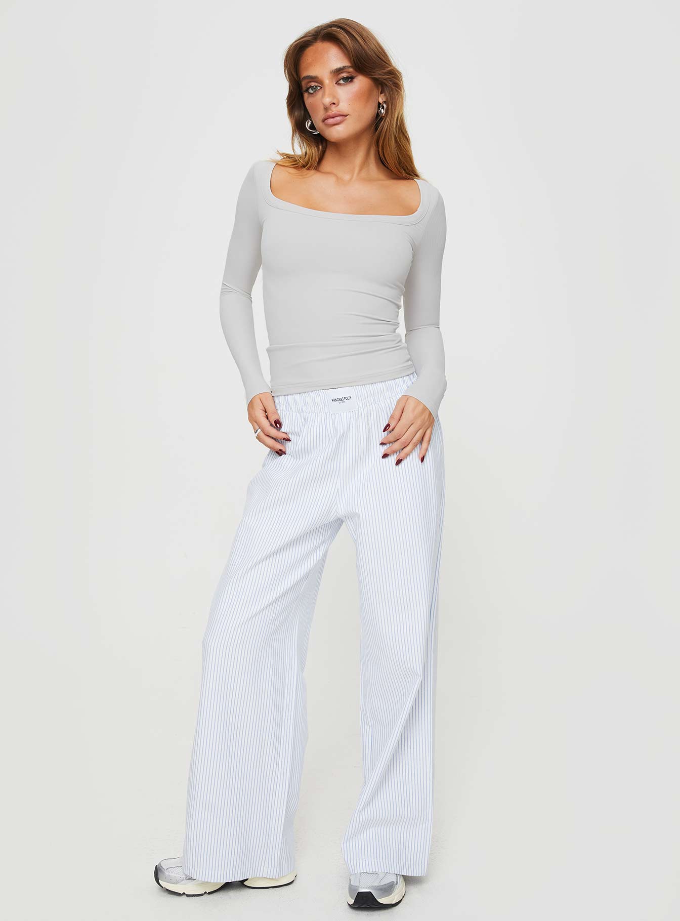 side view of model wearing Princess Polly Arthie Long Sleeve Top Grey Full Sleeves Scoop Neck 