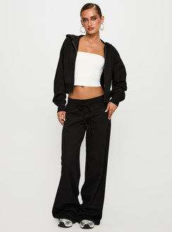 front view of model wearing Princess Polly Mindful Low Rise Pant Black Low Rise Pants 