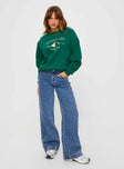 back view of model wearing Princess Polly Apres Ski Crew Neck Sweatshirt Green / Cream 