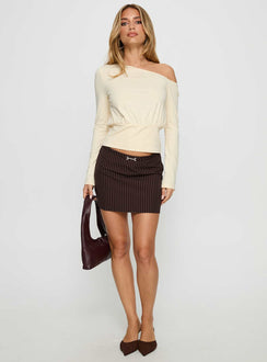   side view of model wearing Princess Polly Yellena Buckle Mini Skirt Brown Pinstripe Mini Skirts 