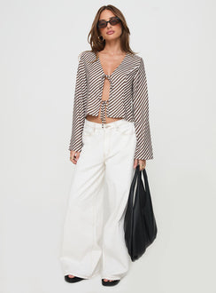 side view of model wearing Princess Polly Maxette Long Sleeve Tie Top Brown Stripe Full Sleeves V-Neck 