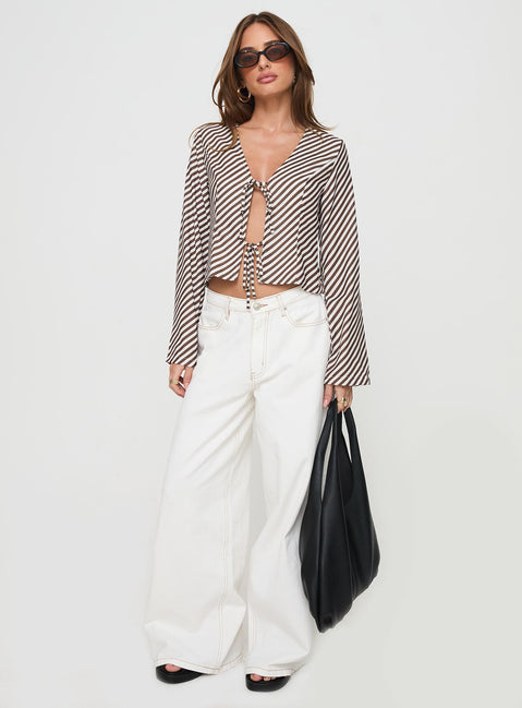 side view of model wearing Princess Polly Maxette Long Sleeve Tie Top Brown Stripe Full Sleeves V-Neck 