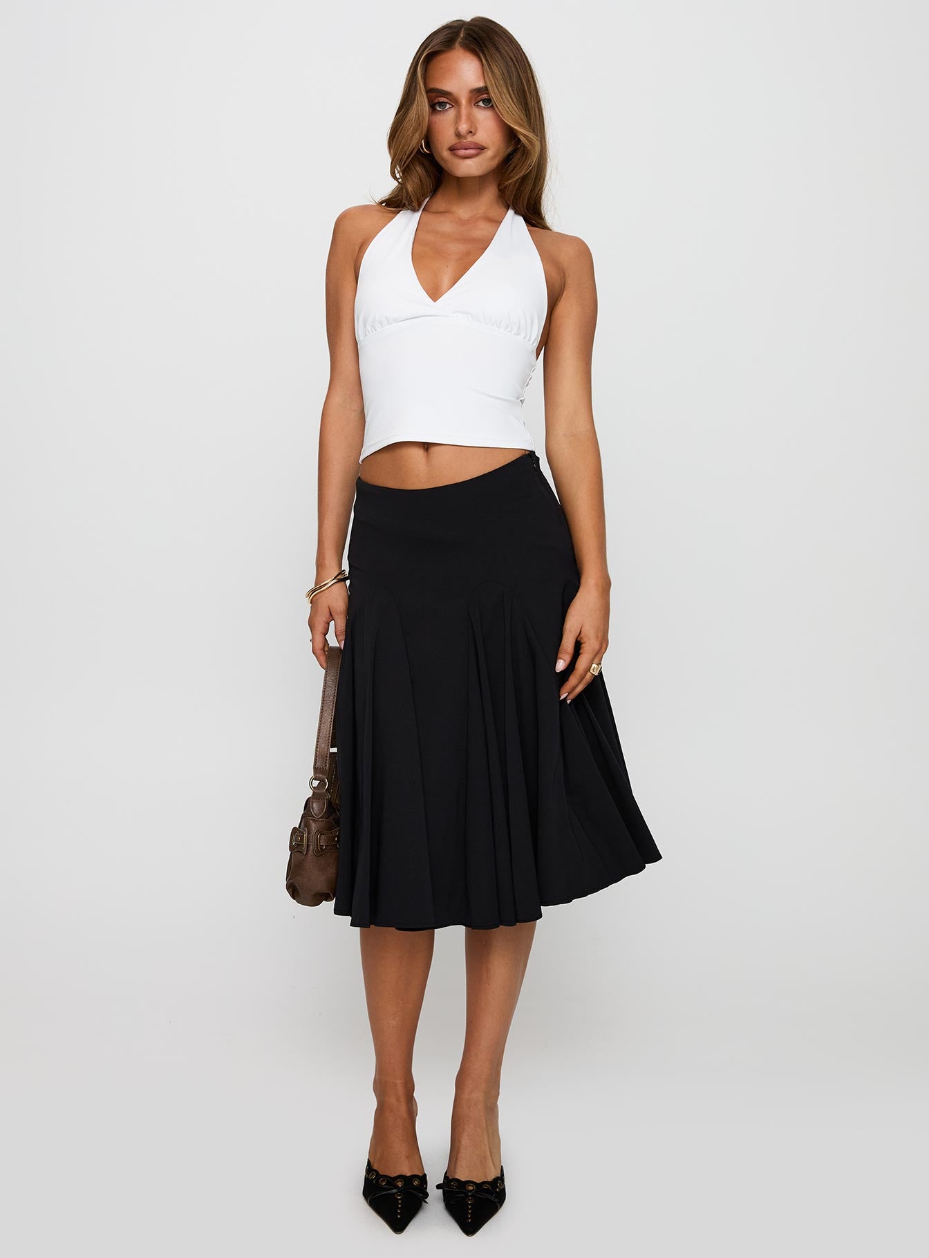   side view of model wearing Princess Polly Agnette Low Rise Midi Skirt Black 