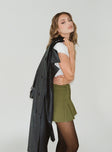 Front view of model wearing  front Stanton Mini Skirt Olive Green Princess Polly  