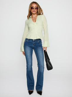 side view of model wearing Princess Polly Elowenn Long Sleeve Top Green Full Sleeves V-Neck 