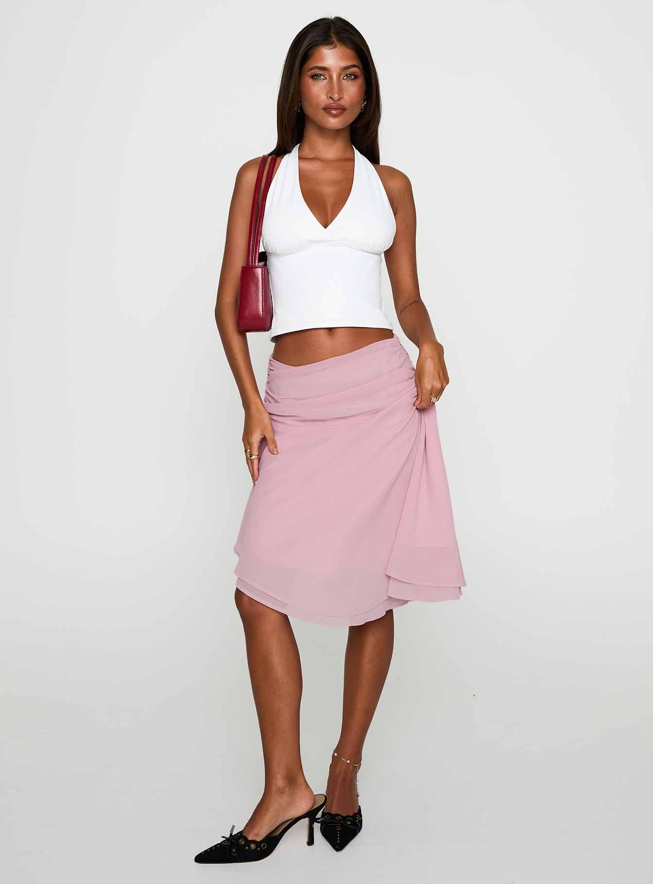  front view of model wearing Princess Polly Evanescence Asymmetrical Midi Skirt Pastel Pink Midi Skirts 
