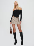 front view of model wearing Princess Polly Korren Low Rise Skort Plaid Tall 