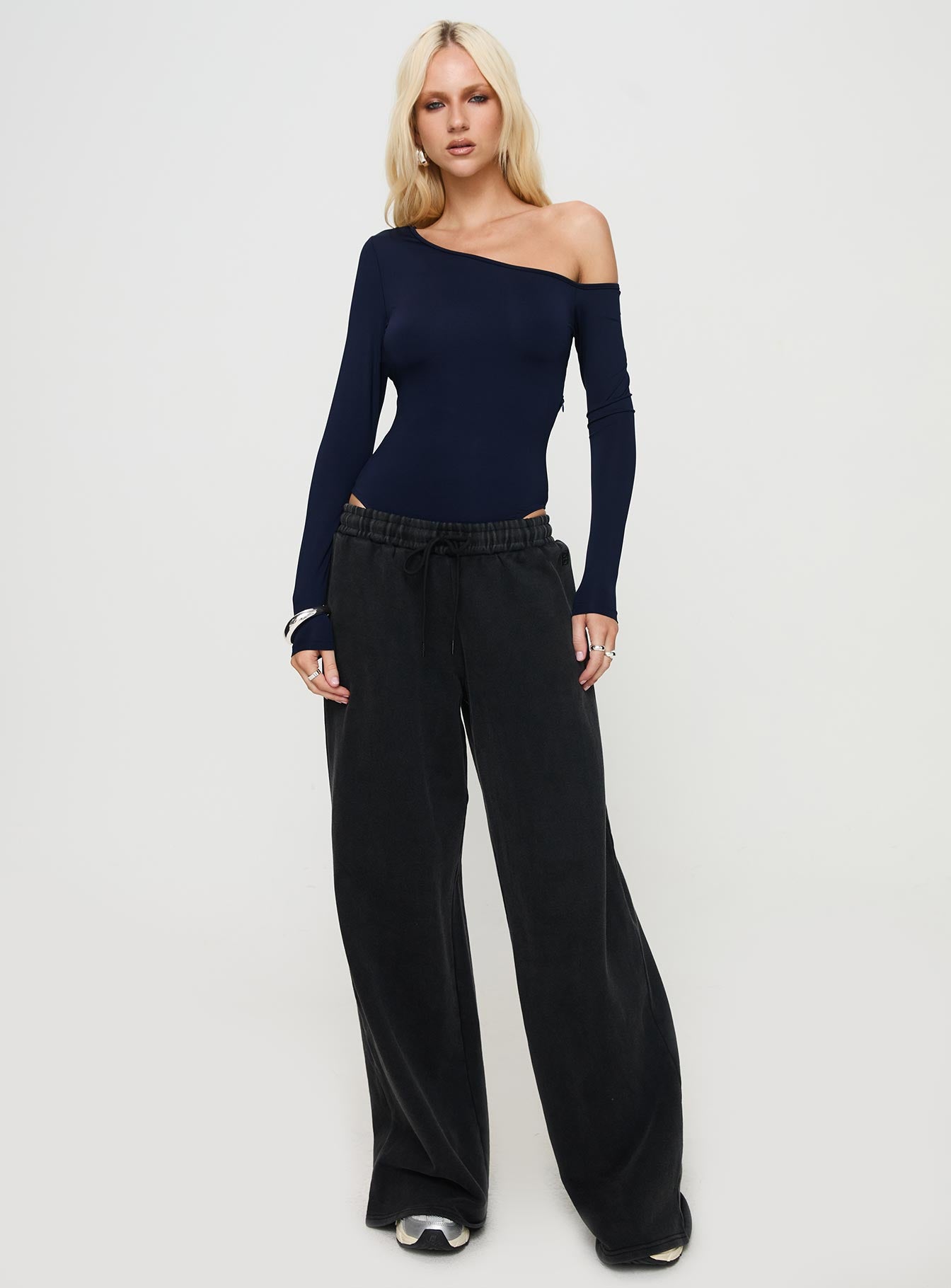 front view of model wearing Princess Polly Caylum One Shoulder Bodysuit Navy Long Sleeve Tops 