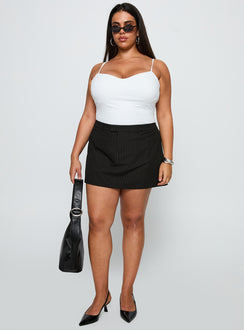 front view of model wearing Princess Polly Feminique Skort Black Stripe Curve High Waisted Shorts 