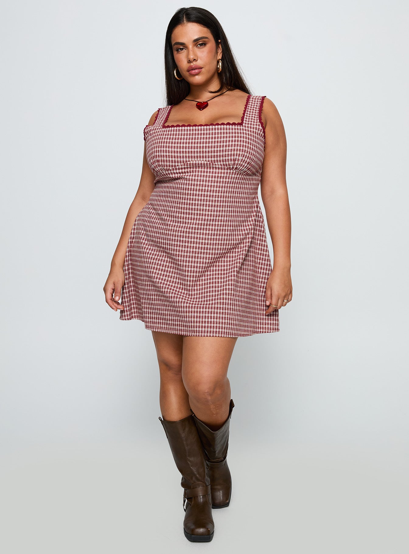side view of model wearing Princess Polly Dasha Mini Dress Red Check Curve Square Neck 