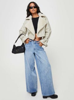 Cropped jacket Faux leather material, oversized collar, removable belts at waist and cuff, buckle fastening