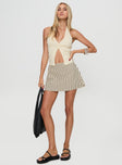 front view of model wearing Princess Polly Gigi Skort Beige Stripe Tall High Waisted Shorts 