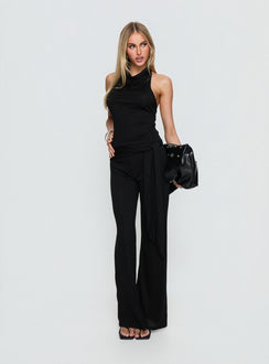side view of model wearing Princess Polly Katiana Wrap Jersey Pants Black Mid Rise Pants 