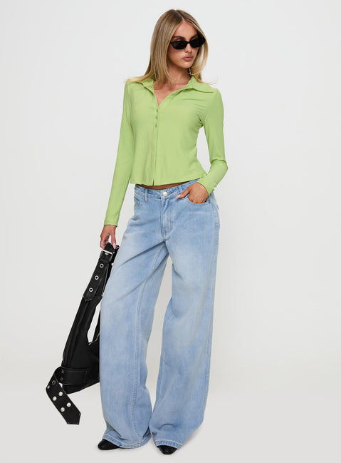 side view of model wearing Princess Polly Echoes Long Sleeve Top Green Full Sleeves V-Neck 