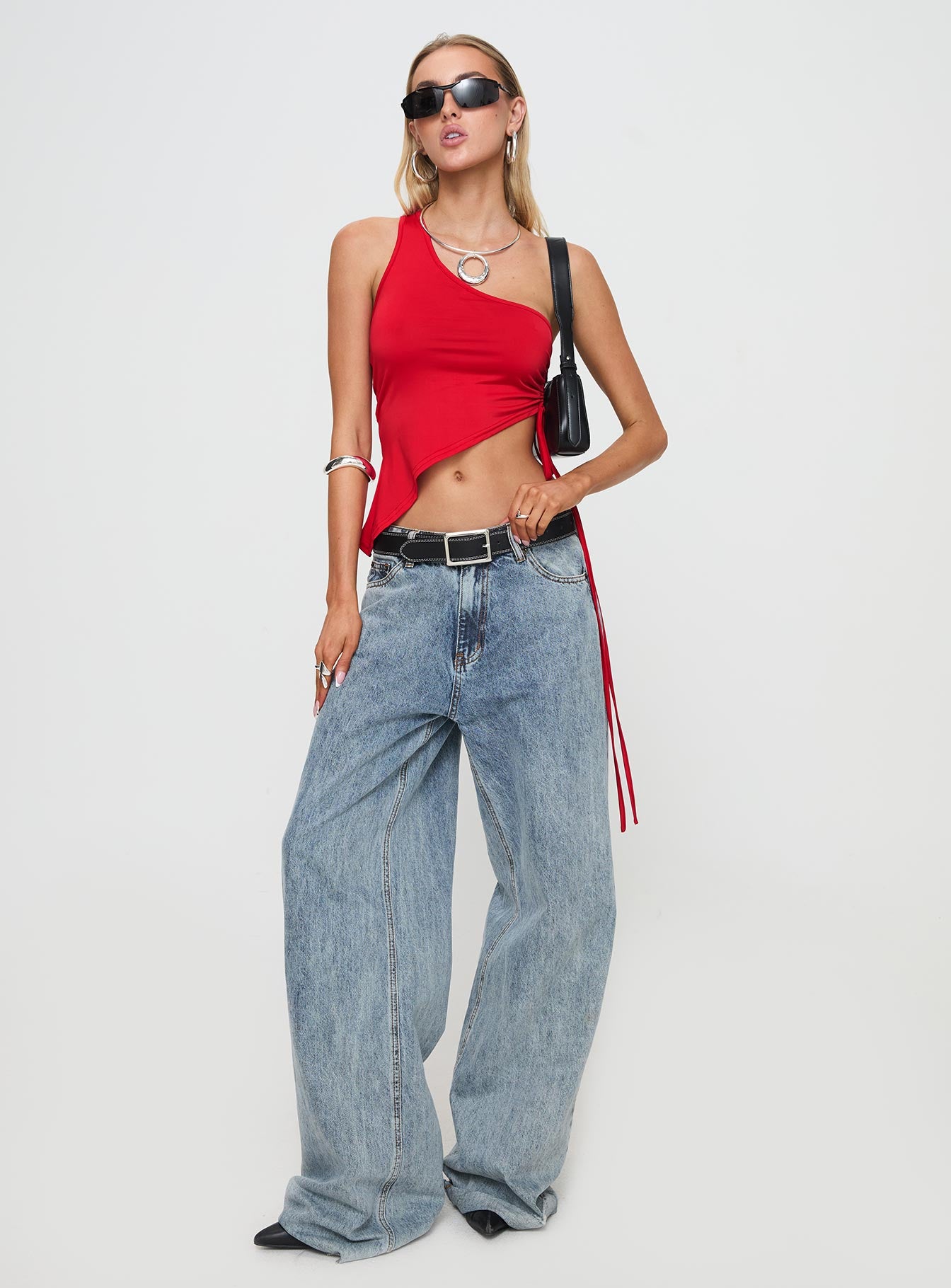 front view of model wearing Princess Polly Servina Top Red Sleeveless Asymmetric Neckline 