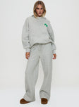 front view of model wearing Princess Polly Princess Polly Hooded Sweatshirt Bubble Text Grey Marle / Green 