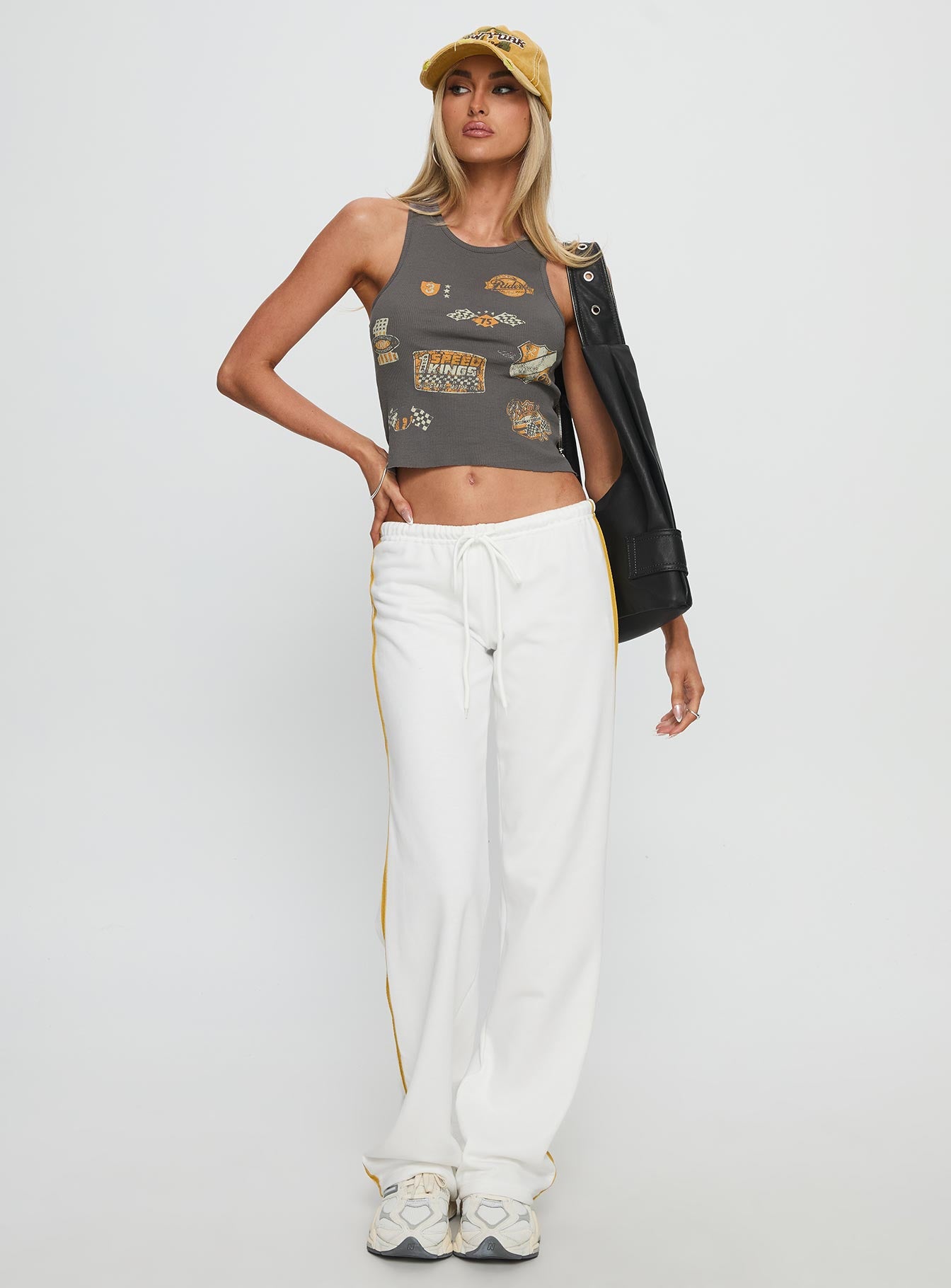 front view of model wearing Princess Polly Elation Low Rise Straight Leg Track Pant White Low Rise Pants 