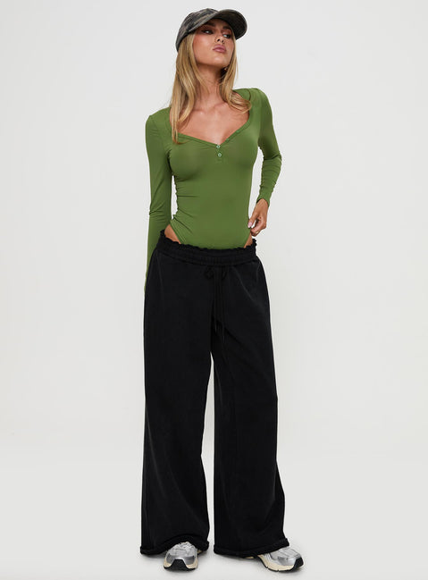 front view of model wearing Princess Polly Delgado Long Sleeve Bodysuit Olive Full Sleeves 