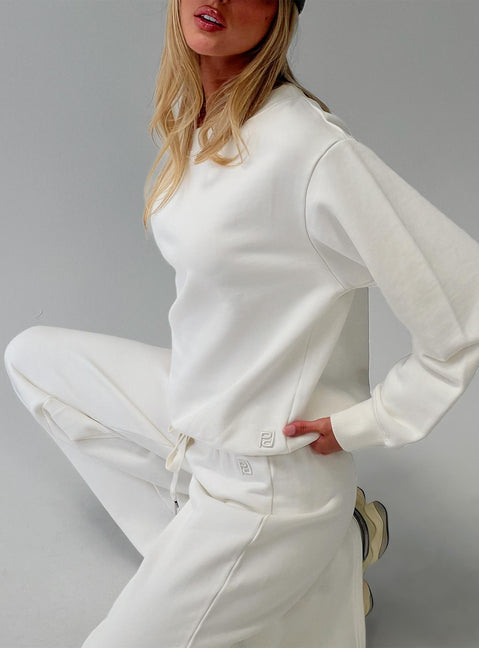 side view of model wearing Princess Polly Wellness Off The Shoulder Jumper Washed White 