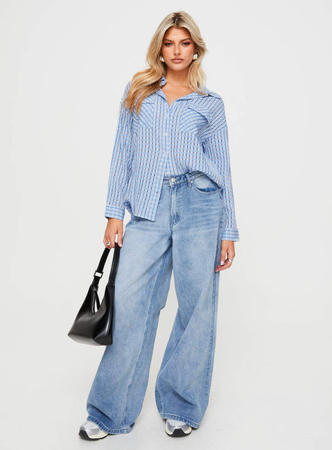 side view of model wearing Princess Polly Oristano Shirt Blue Full Sleeves V-Neck 