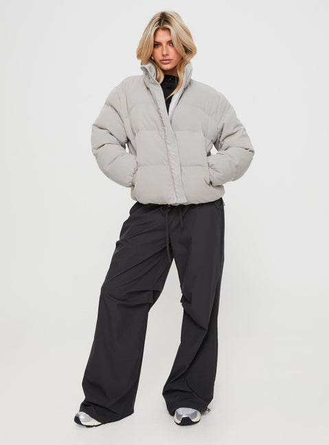 Ribbed puffer jacket High neckline, twin hip pockets, zip fastening down front, drawstring waist, elasticated cuffs