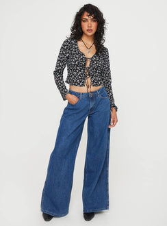 Front view of model wearing  front Princess Polly Full Sleeves Crew Neck  Mekki Long Sleeve Top Black Floral