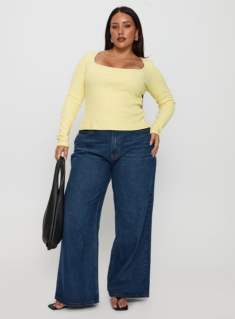 side view of model wearing Princess Polly Baseline Long Sleeve Top Yellow Curve Full Sleeves Scoop Neck 