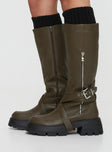 Knee-high faux leather boots Strappy upper, silver-toned buckles, round toe, treaded sole, contrast sole, zip fastening 