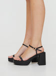Faux leather heel Single strap upper, rounded toe, buckle fastening at ankle, block heel