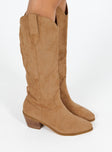 Cowboy boots Faux suede material  Detail stitching  Knee high length  Rounded hem  Pull tabs  Pointed toe  Fully lined