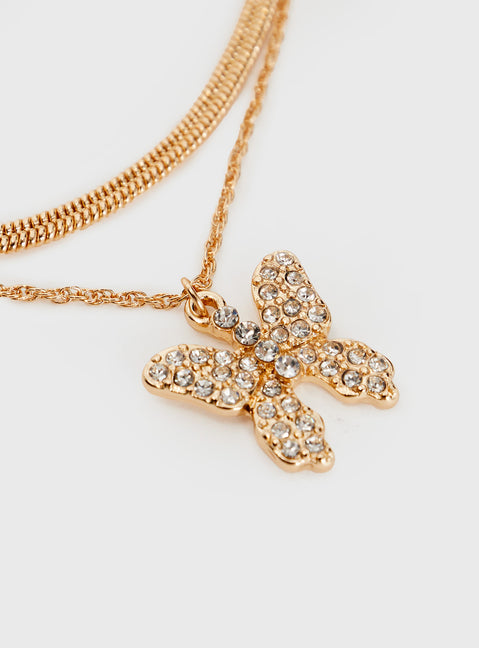 Gold-toned necklace Two separate chains, large charm with diamante detail, lobster clasp fastening