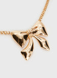 Gold-toned necklace Bow charm, lobster clasp fastening