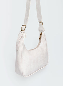 Shoulder bag Adjustable shoulder strap  Gold-toned hardware   Zip fastening  Single internal zip pocket  Flat base 