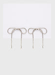 Silver-toned earrings Bow design, stud fastening