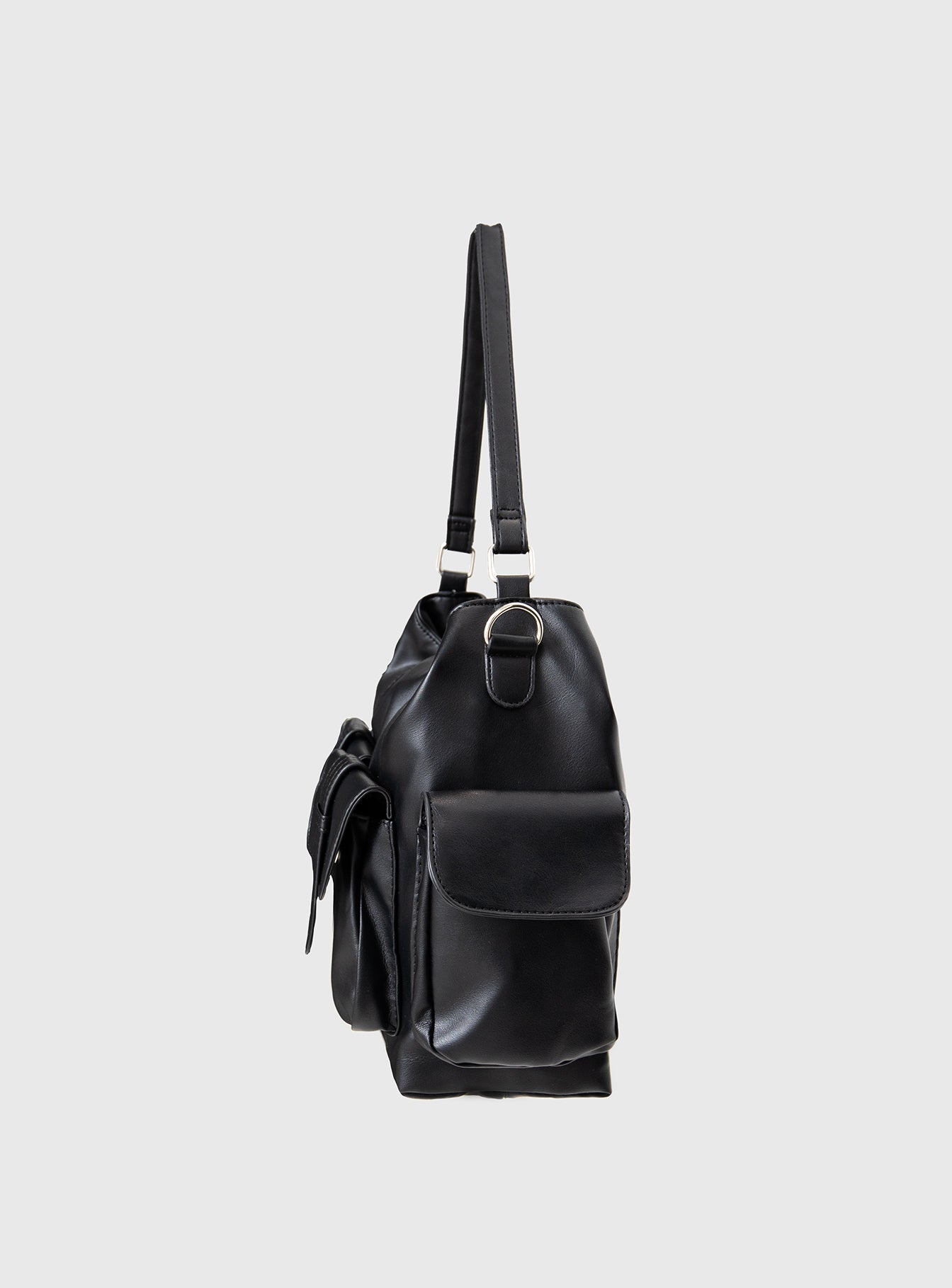 Faux leather bag Adjustable & removable shoulder and crossbody straps, silver-toned hardware, zip fastening, four external magnetic button fastening pockets, flat base