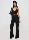 side view of model wearing Princess Polly Stellina Slim Fit Flared Pants Black High Waisted Pants 