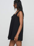 side view of model wearing Princess Polly Swing Mini Dress Black Petite Square Neck 