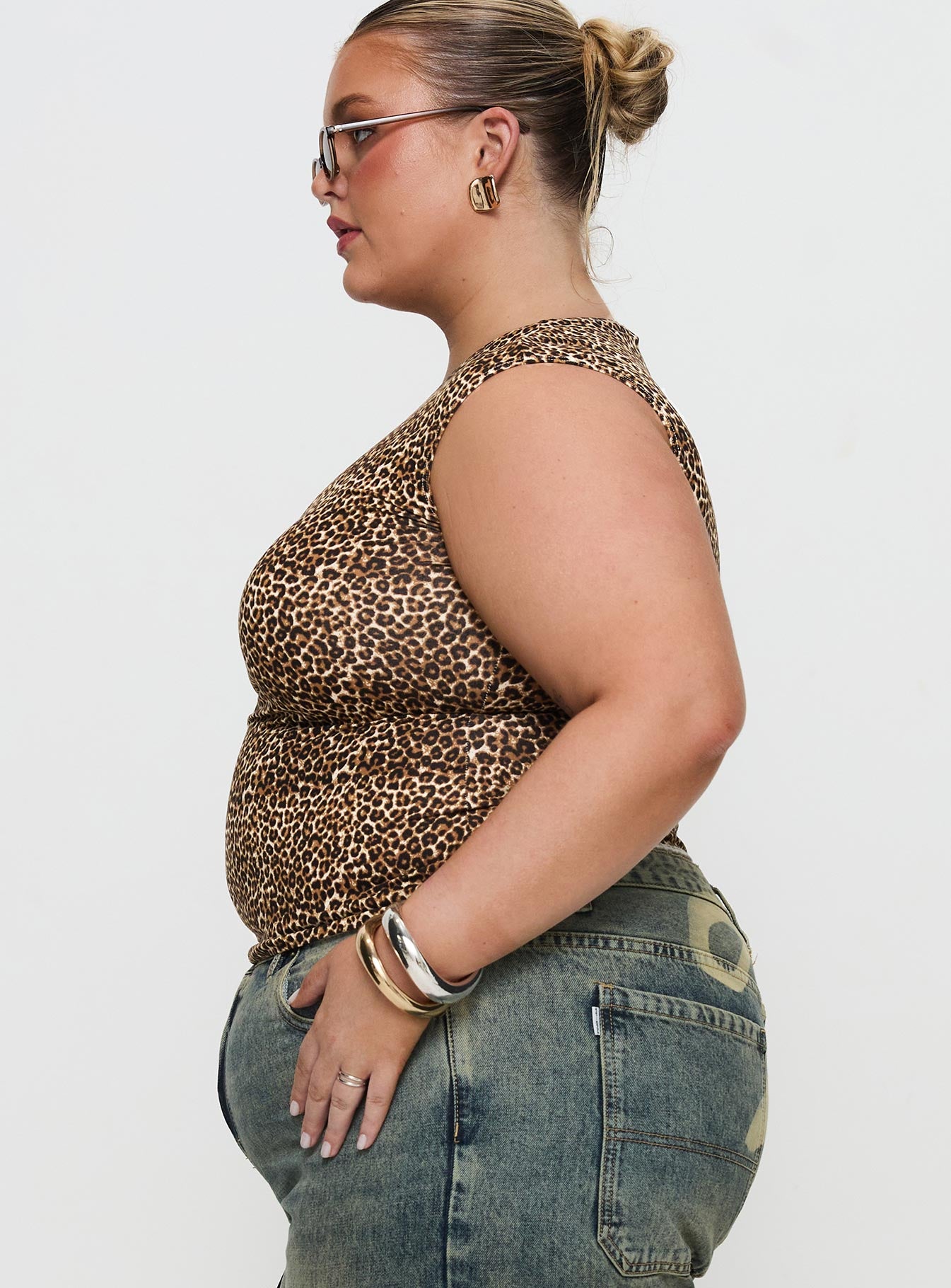 side view of model wearing Princess Polly Lure Top Leopard Curve Sleeveless Crew Neck 