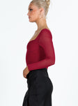 side view of model wearing Princess Polly Bruna Top Long Sleeve Red Lower Impact Full Sleeves Sweetheart 