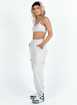 Matching set Crop top Fixed shoulder straps Scooped neckline Invisible zip fastening at side Track pants High rise Elasticated waistband Twin hip pockets Straight leg Extra cargo style leg pockets Elasticated cuff