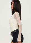 side view of model wearing Princess Polly Boxwood Long Sleeve Top Cream Full Sleeves Boat Neck 