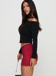   side view of model wearing Princess Polly Meredith Ruched Mini Skirt Red Mini Skirts 