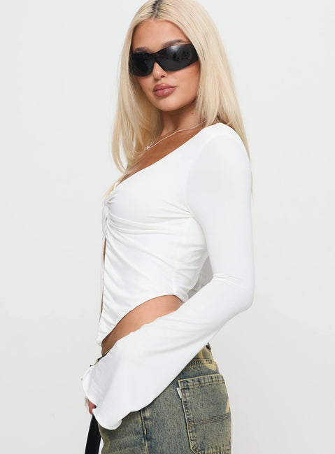 side view of model wearing Princess Polly Holli Long Sleeve Twist Top White Full Sleeves Plunger 