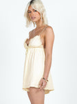 Romper, V-neckline, textured material Adjustable shoulder straps, frill detail, elasticated waistband