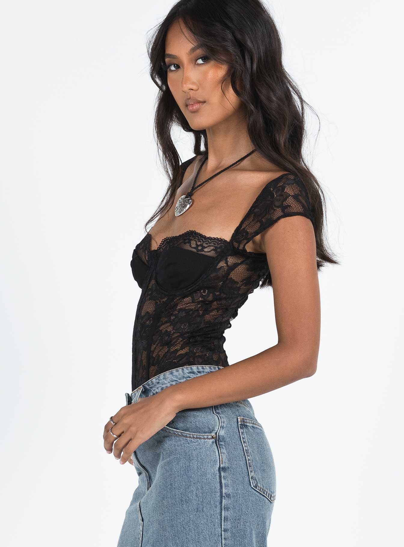 side view of model wearing Princess Polly Cadrot Lace Bodysuit Black Short Sleeve 