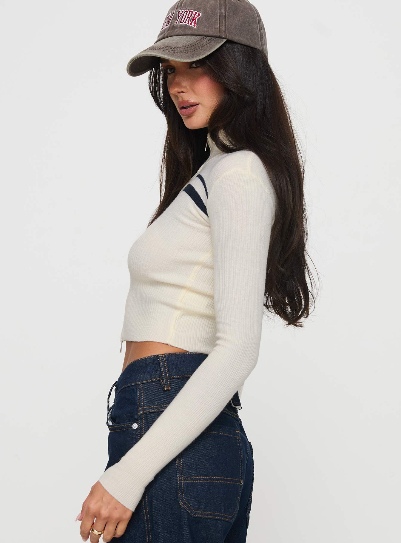 side view of model wearing Princess Polly Slow It Down Long Sleeve Top Cream Full Sleeves High Neck 