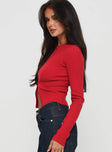 side view of model wearing Princess Polly Suzu Long Sleeve Top Red Full Sleeves High Neck 