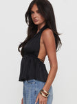 side view of model wearing Princess Polly Saddler Halter Top Black Sleeveless Plunger 